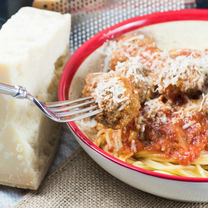 Spaghetti and Meatballs in Marinara Sauce on a fork in a bowl