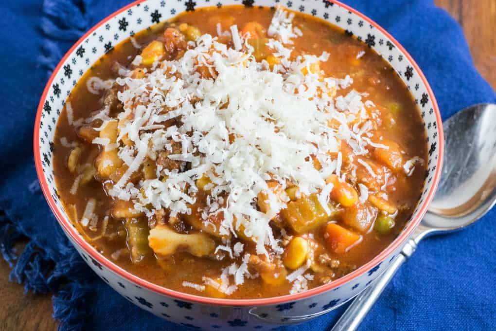 Bowl of minestrone soup topped with Parmesan cheese