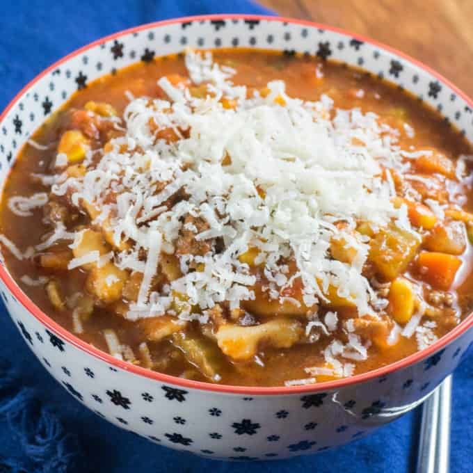 Bowl of Easy Peasy Hamburger Minestrone Soup topped with Parmesan cheese