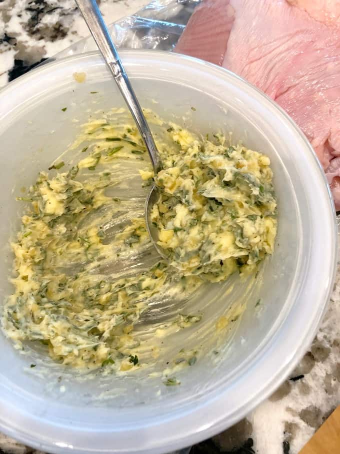 Herbed butter in a white bowl