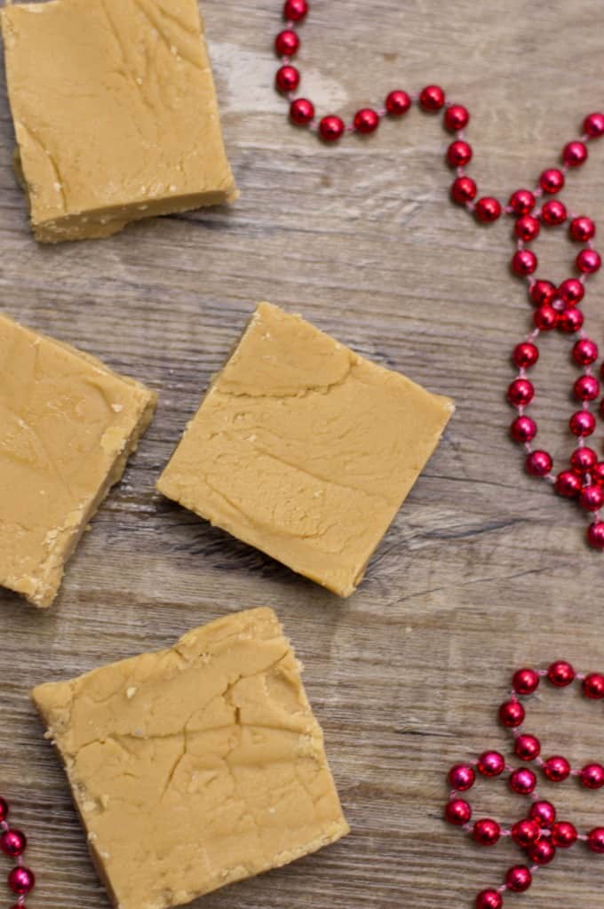 Easy Peanut Butter Fudge in squares on a board