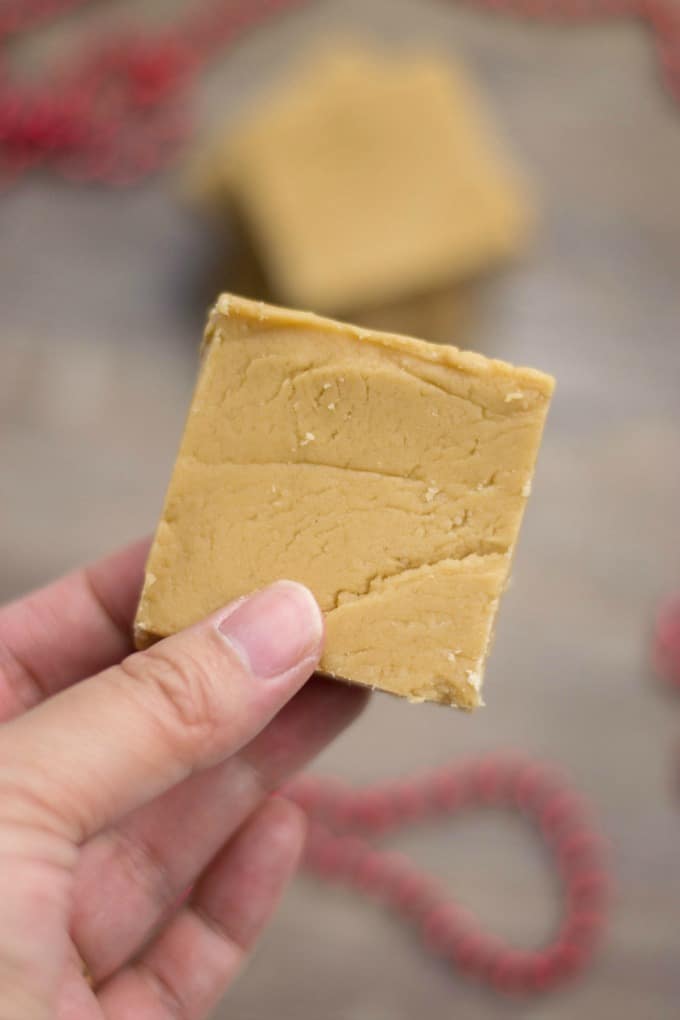 Easy Peanut Butter Fudge square held in a hand
