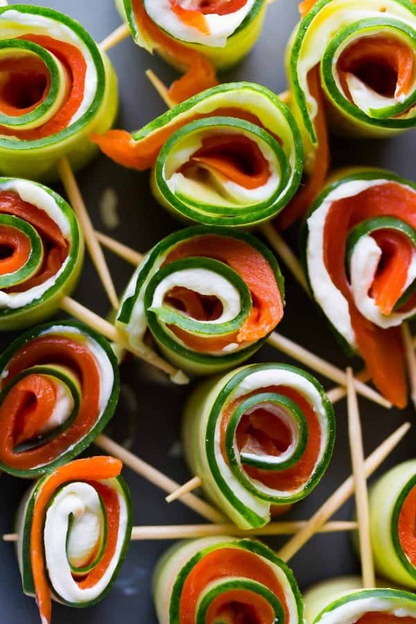 Smoked salmon cucumber roll-ups on a tray