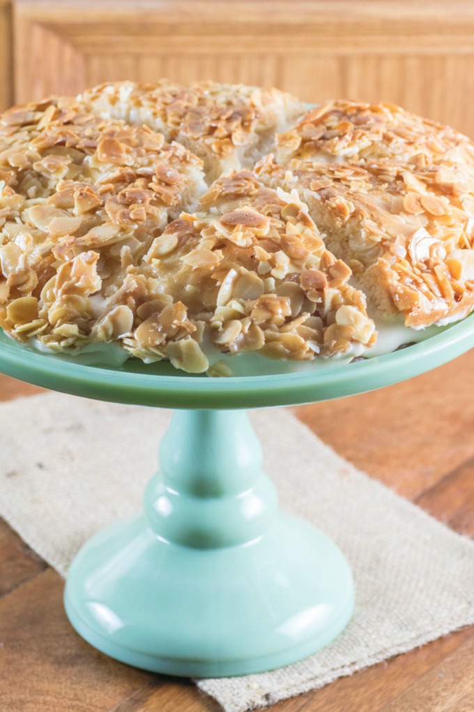 Bee Sting Cake sliced on a cake stand. 