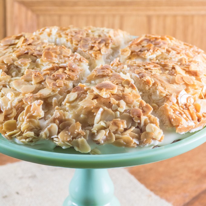 Bee Sting Cake sliced on a cake stand. 