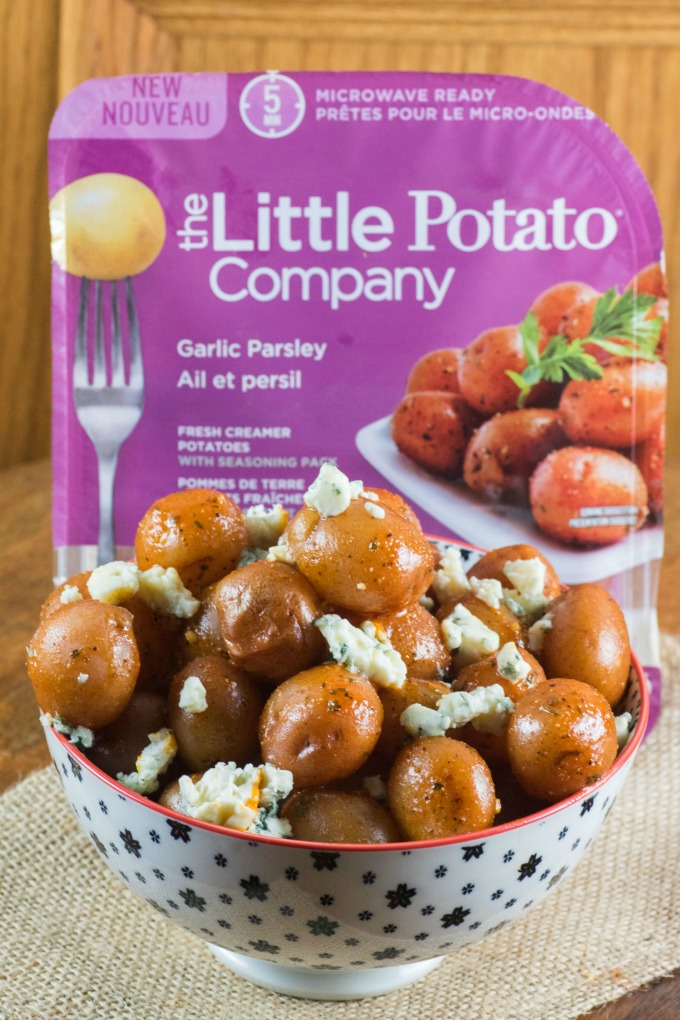 Buffalo Wing Potatoes in a bowl with The Little Potato Company's Microwave Ready Pack