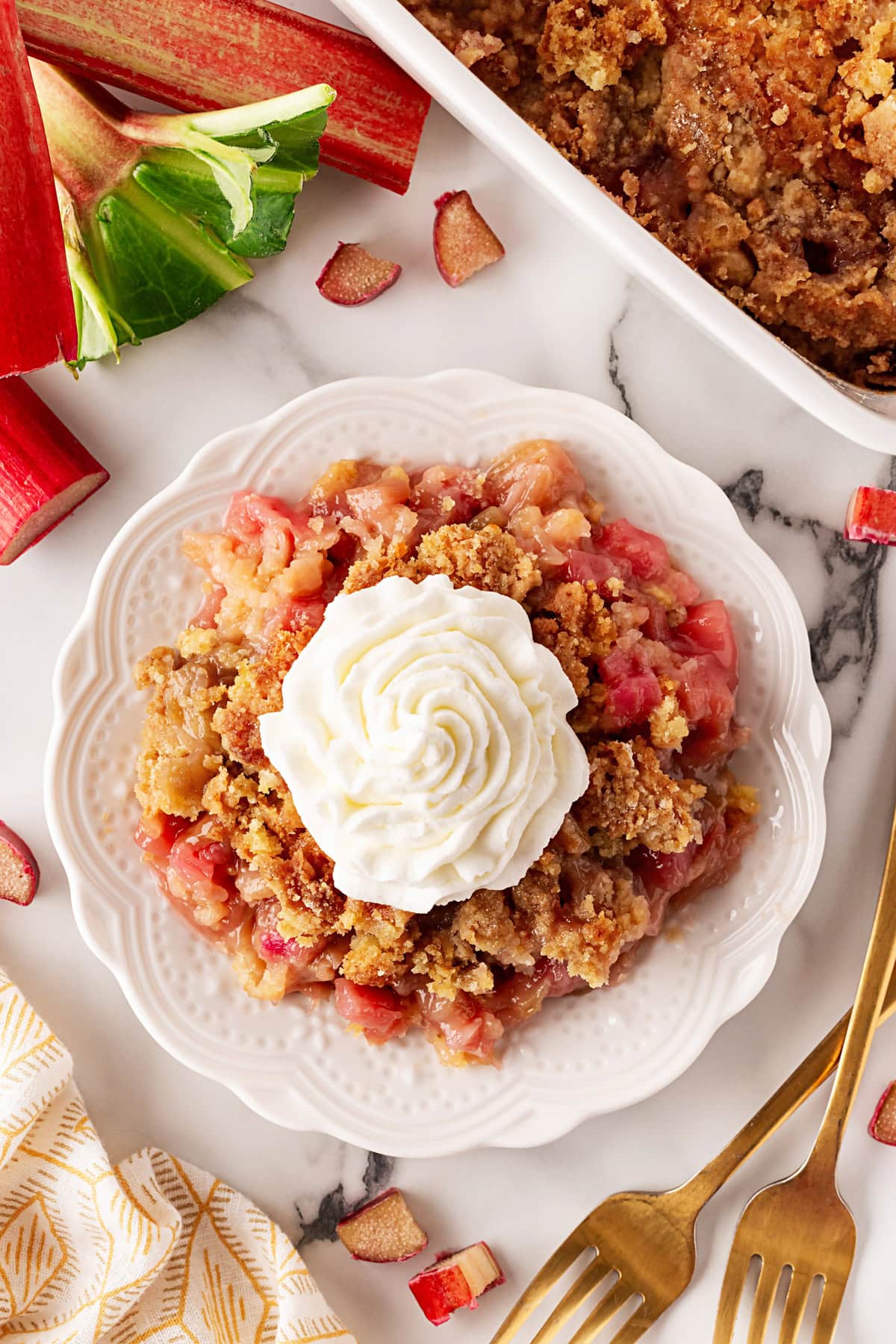 Overhead of the cake on a plate with whipped cream. 