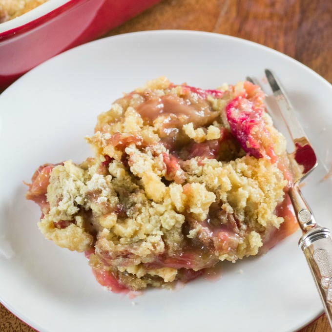 Rhubarb Dump Cake on a plate with a fork