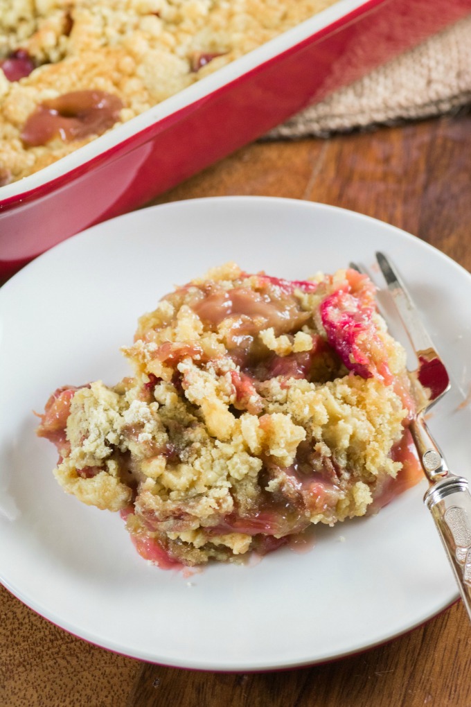 Rhubarb Dump Cake on a plate with a fork