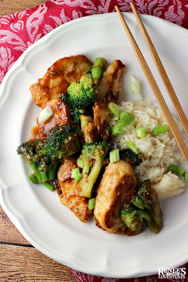 Easy Chicken and Broccoli Stir Fry on a white plate with chopsticks