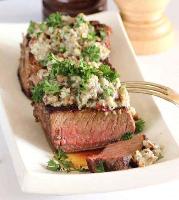 Beef Tenderloin with Stilton Pecan Butter on a plate sliced