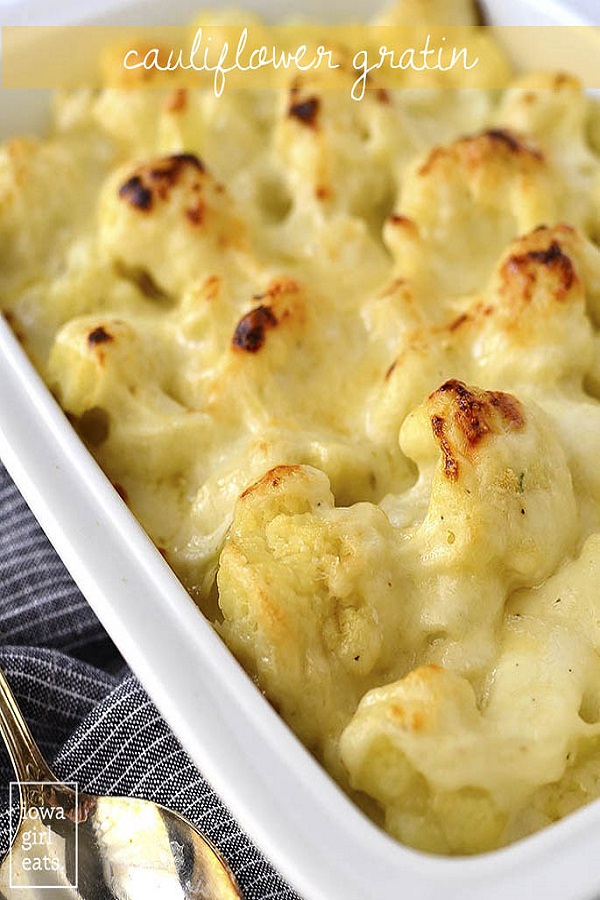 40 Amazing Easter Side Dishes, Cauliflower gratin in a white casserole dish with a silver serving spoon