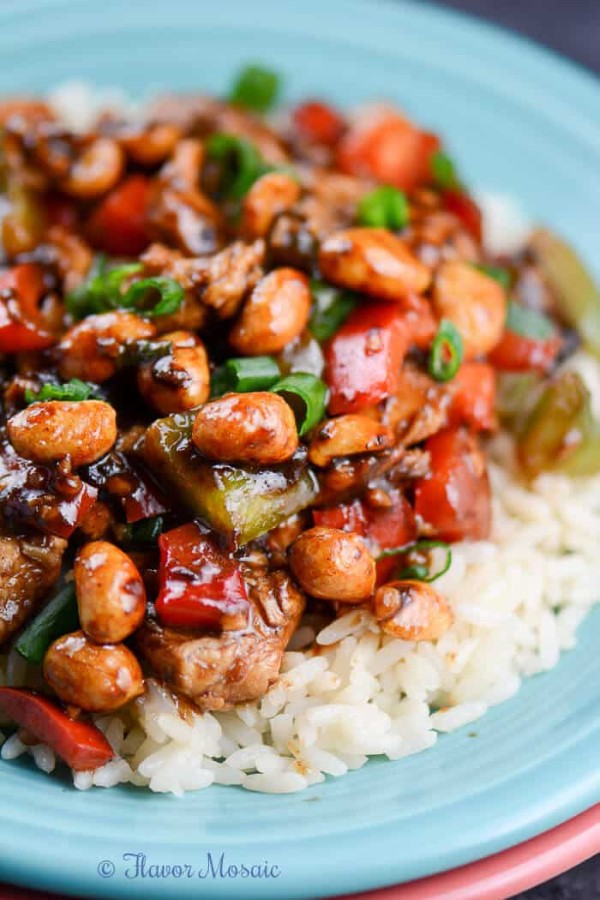 Easy Kung Pao Chicken Recipe over rice on a blue plate