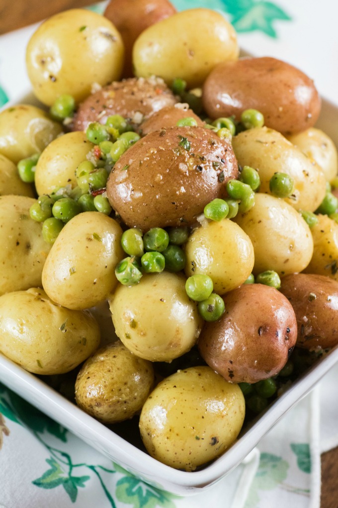 Herb Lemon Butter Peas and Little Potatoes in a white bowl