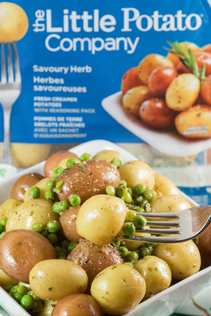 Herb Lemon Butter Peas and Little Potatoes picked up with a fork