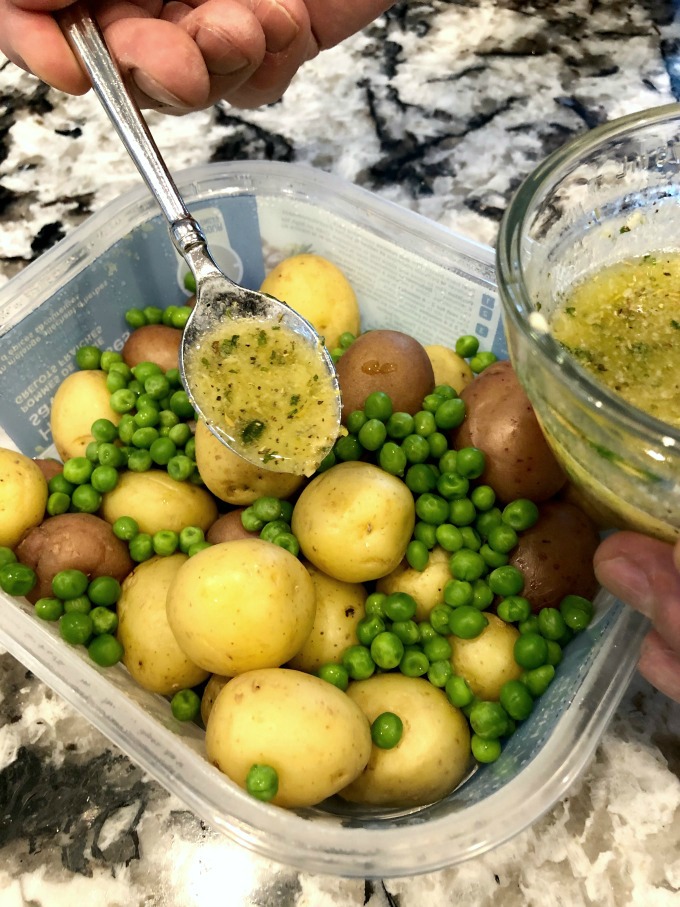 Butter sauce over potatoes and peas