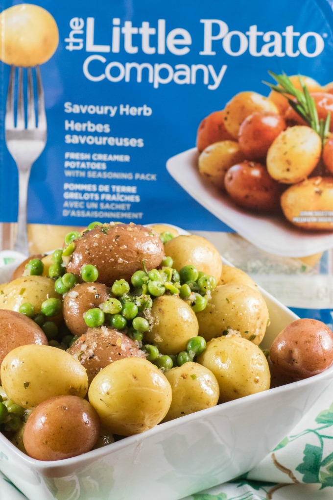 Herb Lemon Butter Peas and Little Potatoes in a bowl with a potato microwave pack