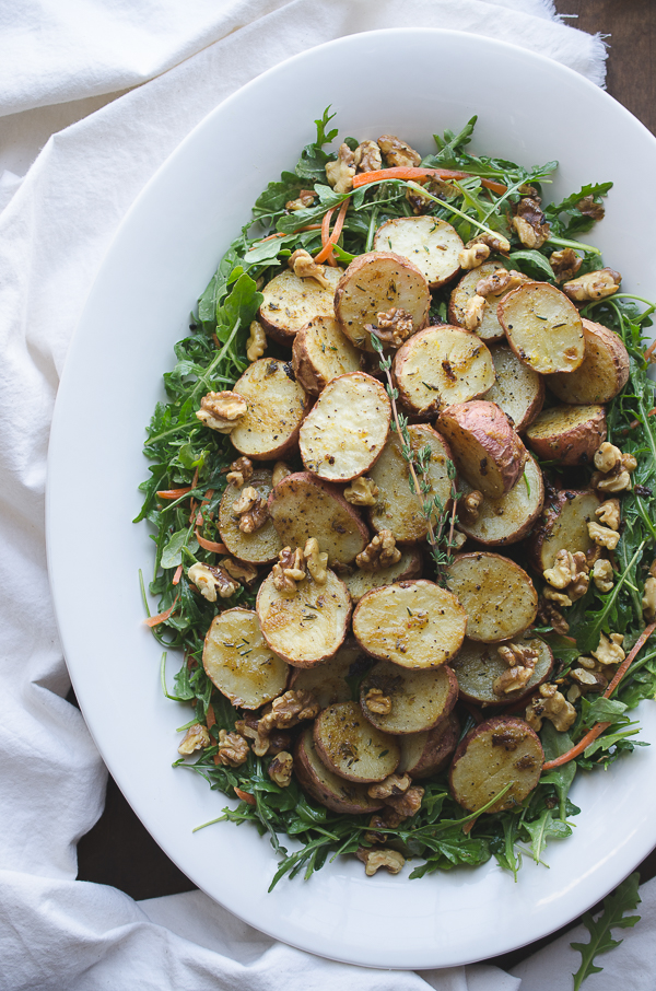 Lemon Dijon potato salad in a white serving bowl