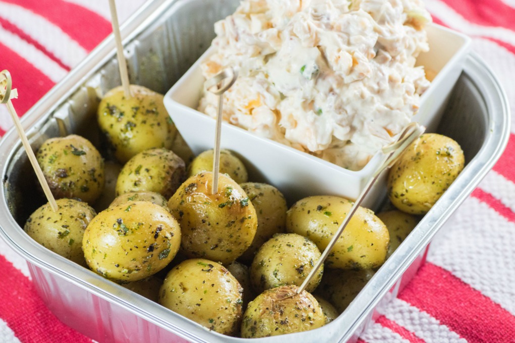 Million Dollar Dip with Roasted Little Potatoes in a pan with toothpicks