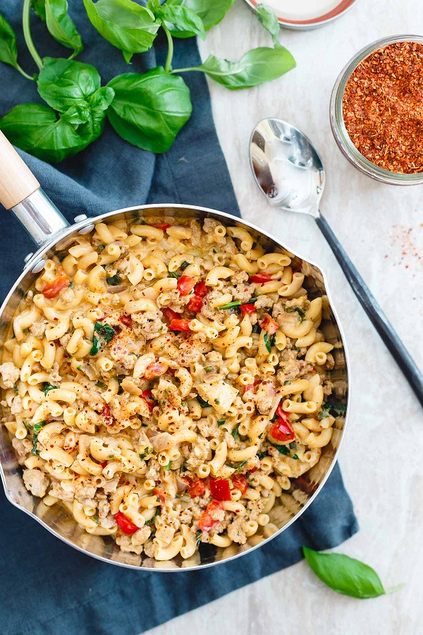 Turkey Skillet Mac and Cheese in a skillet with a serving spoon