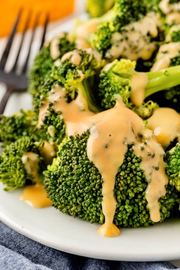 Cheese sauce poured over broccoli. 