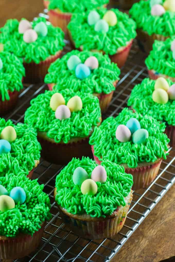 Easter cupcakes on a wire rack. 