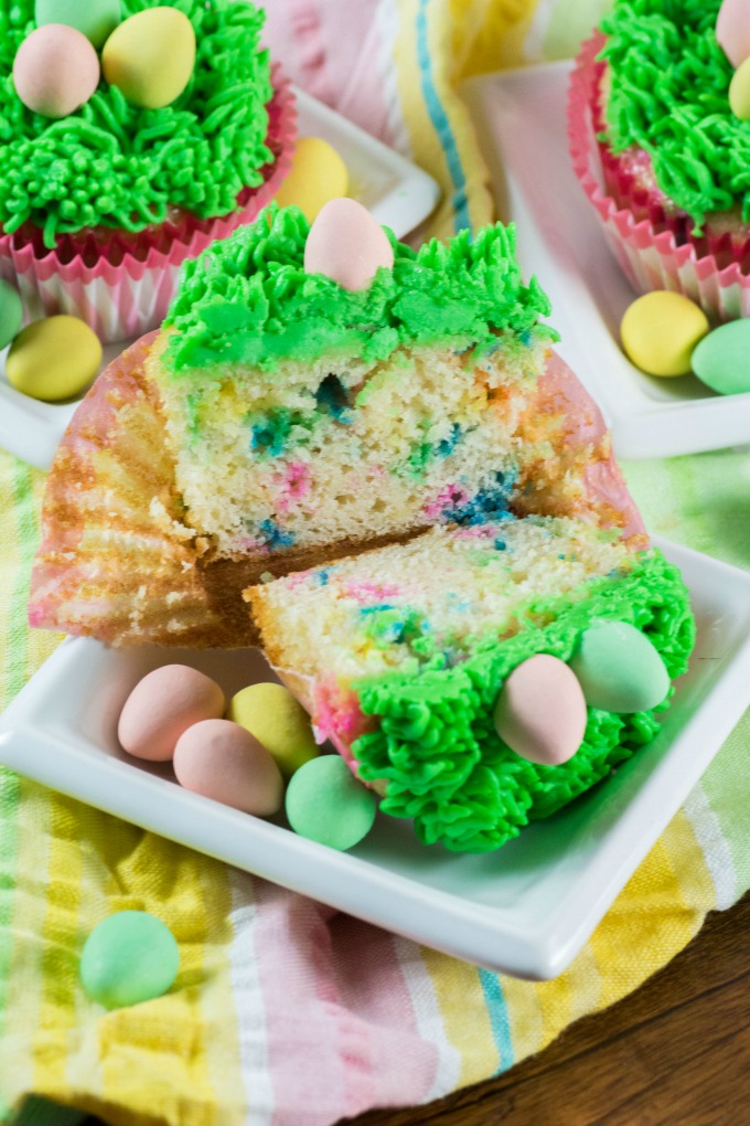 Easter Cupcake cut in half to show sprinkles on the inside.