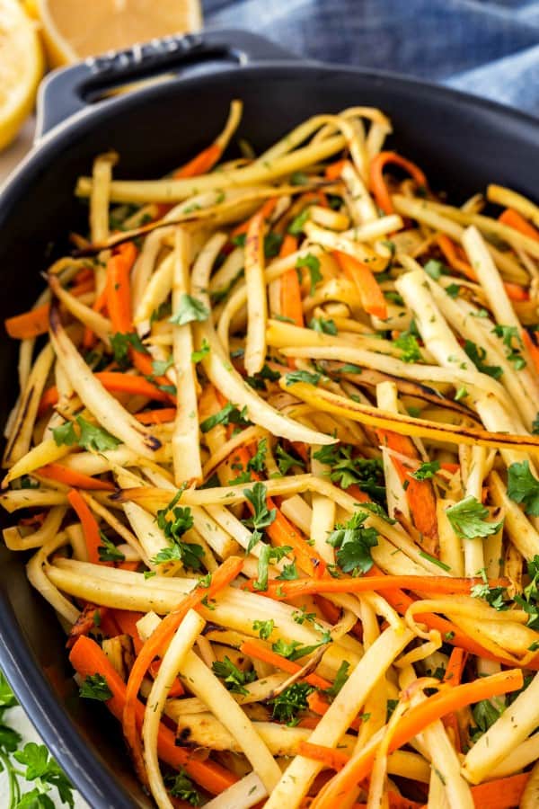 Pan-Fried parsnips and carrots in a oval casserole dish. 