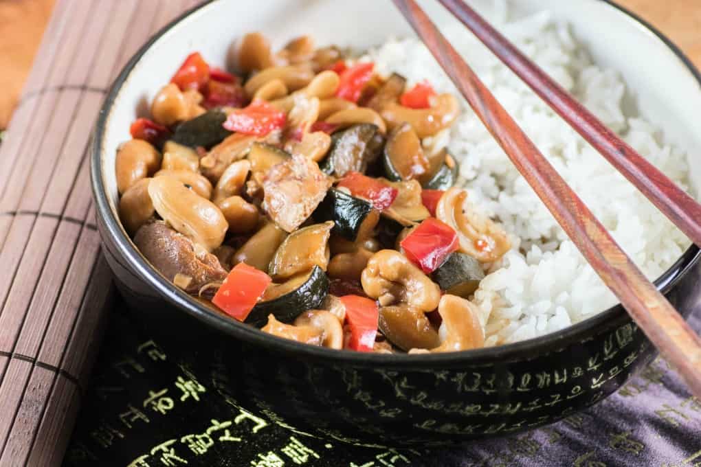 Sweet and Spicy Kung Pao Chicken in a bowl with chop sticks!