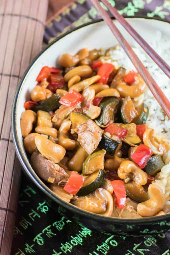 Sweet and Spicy Kung Pao Chicken in a bowl with chop sticks!