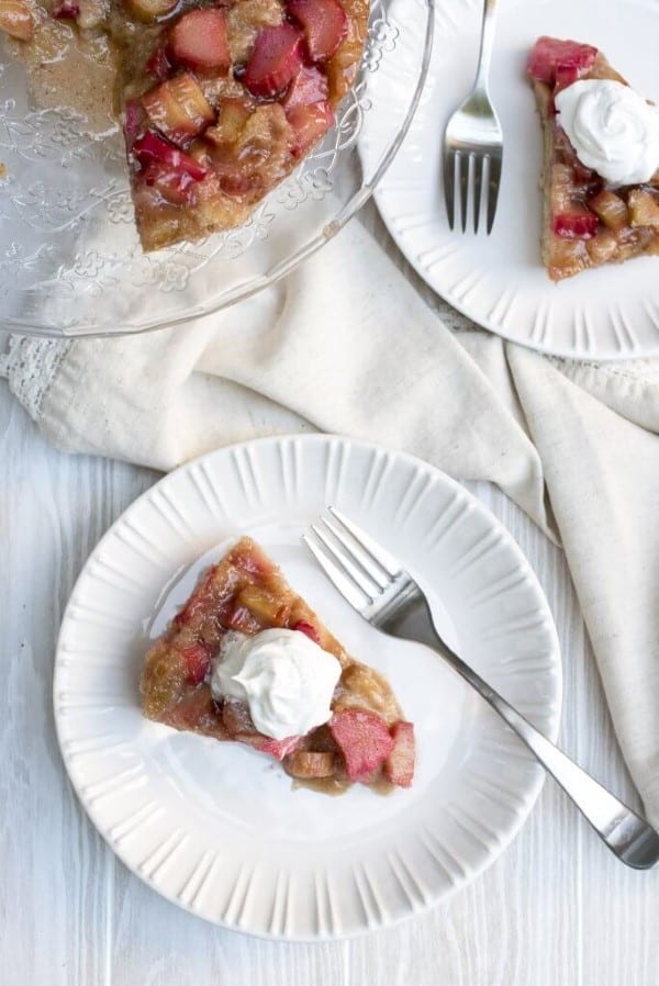 Rhubarb Upside Down Cake on a white plate with fork