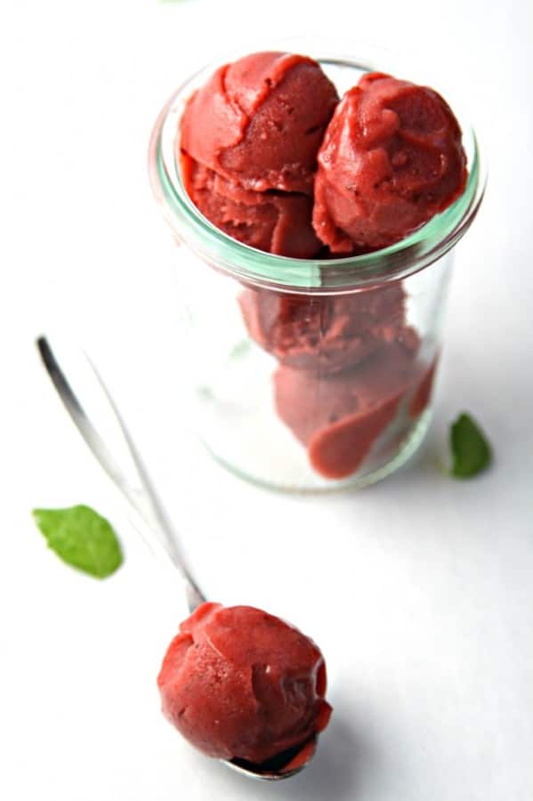 Balsamic Roasted Rhubarb Sorbet scooped into a clear glass