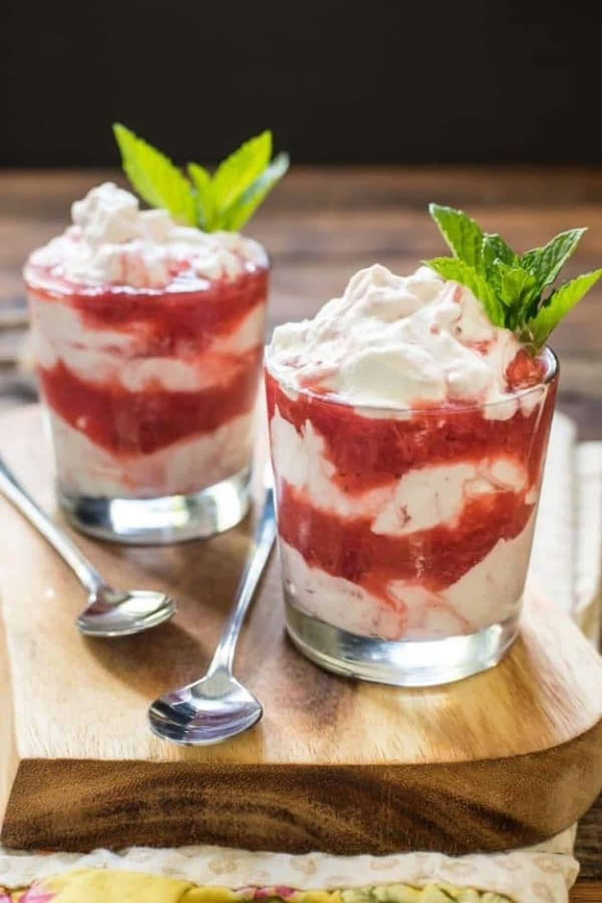 Strawberry Rhubarb served in a glass with mint leaves.