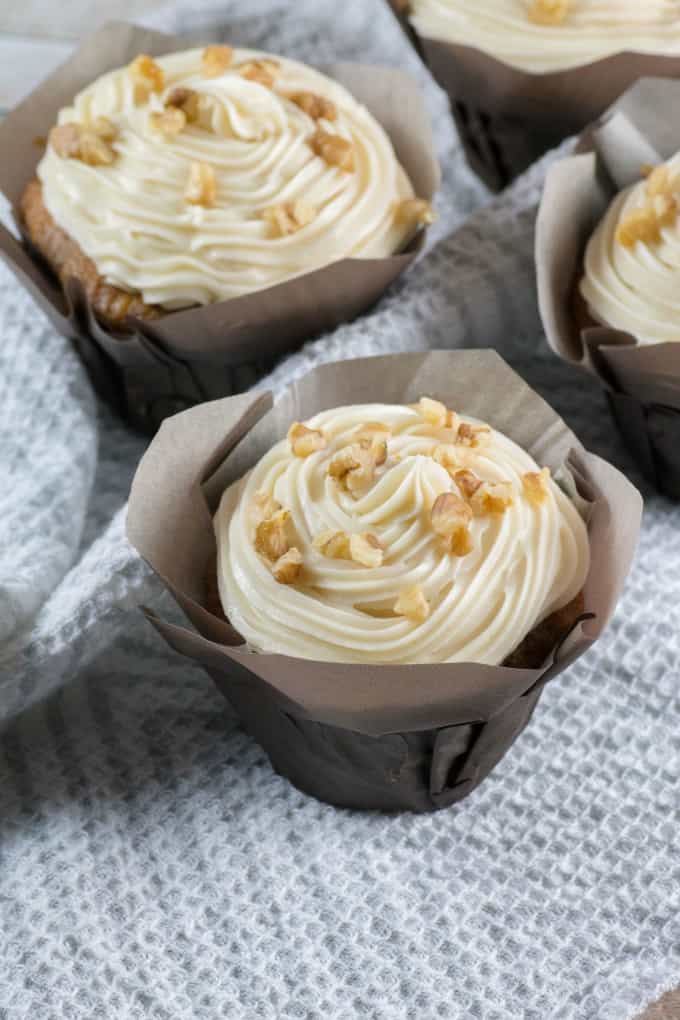 Carrot Cake Cupcakes on a grey and white tea towel