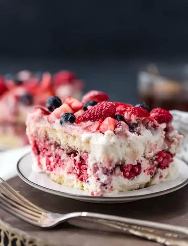 Blueberry, Raspberry, Strawberry Tiramisu on a white plate with forks
