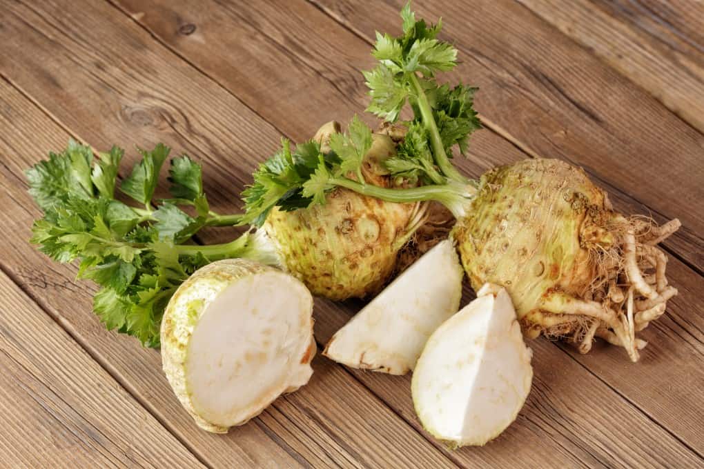 Celery Root with some sliced up on a board