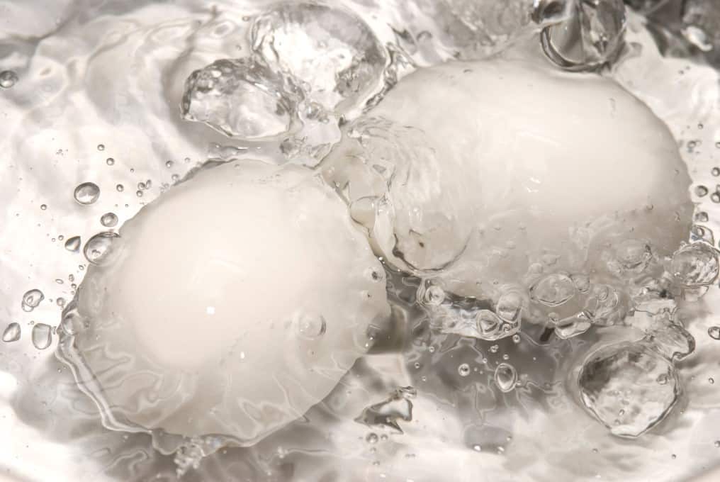 Eggs boiling in water