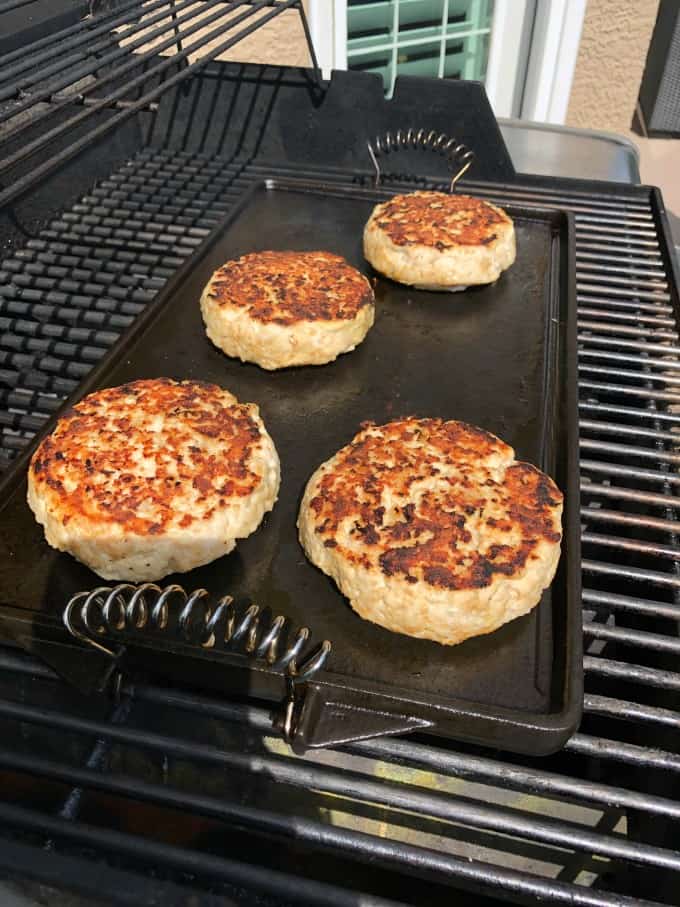 Turkey burgers on a flat top on the grill