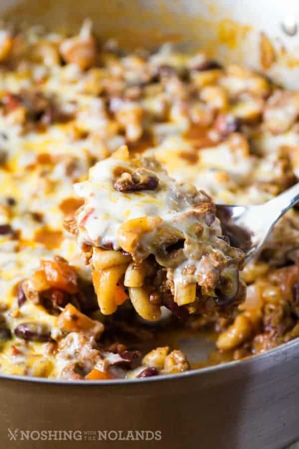 Spooning out EASY CHILI MAC SKILLET DINNER