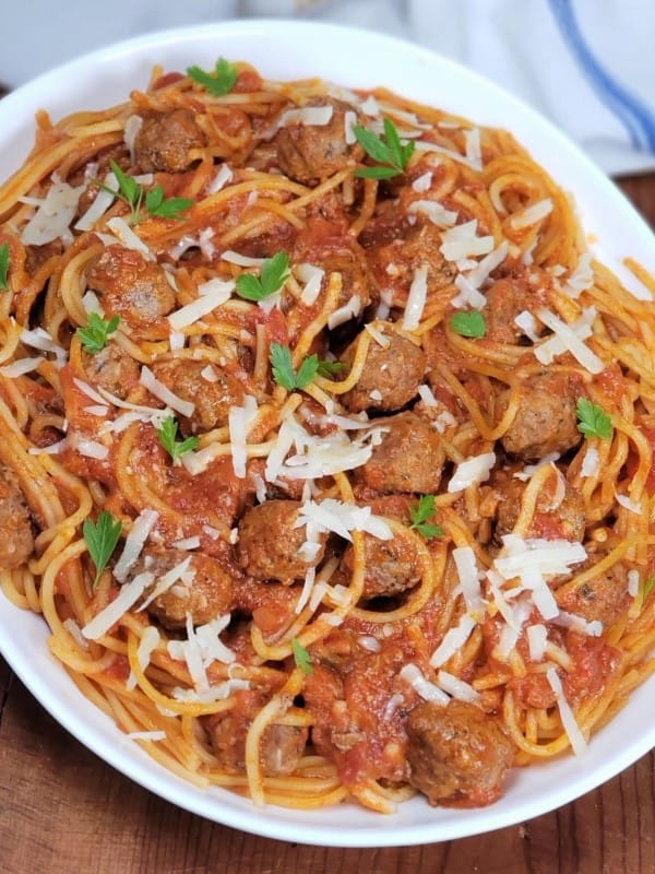 INSTANT POT SPAGHETTI AND MEATBALLS on a white platter