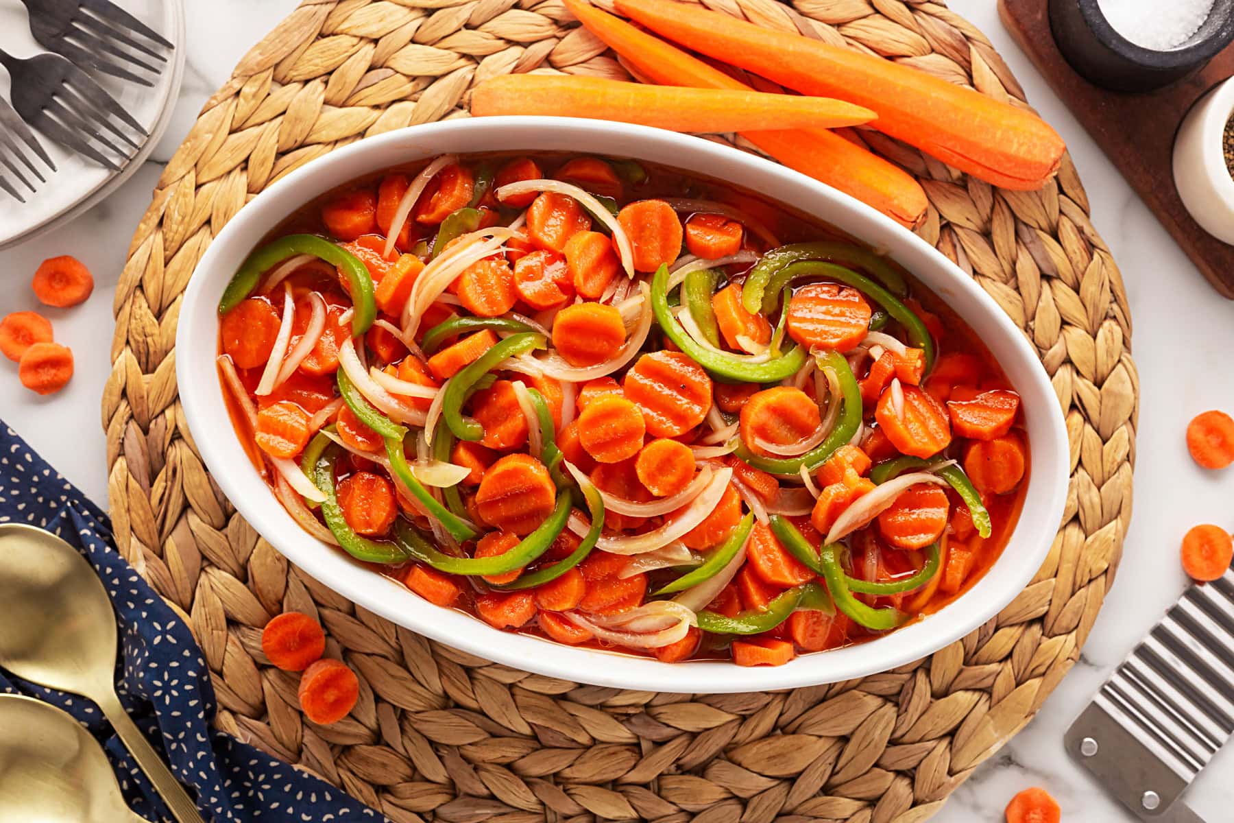 This Marinated Carrot Salad was a staple in our fridge as I grew up. It can be marinated for a long time, so it is perfect to have at the ready for any outing. Overhead zoomed back carrot salad.