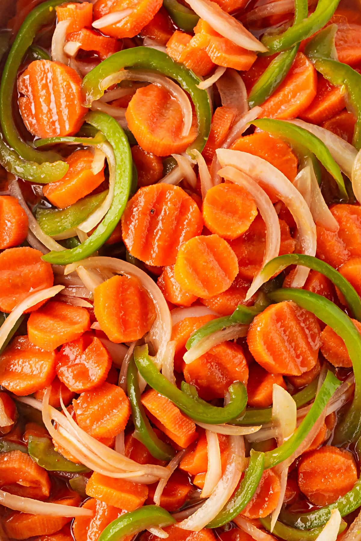 This Marinated Carrot Salad was a staple in our fridge as I grew up. It can be marinated for a long time, so it is perfect to have at the ready for any outing. Overhead close-up of the salad.
