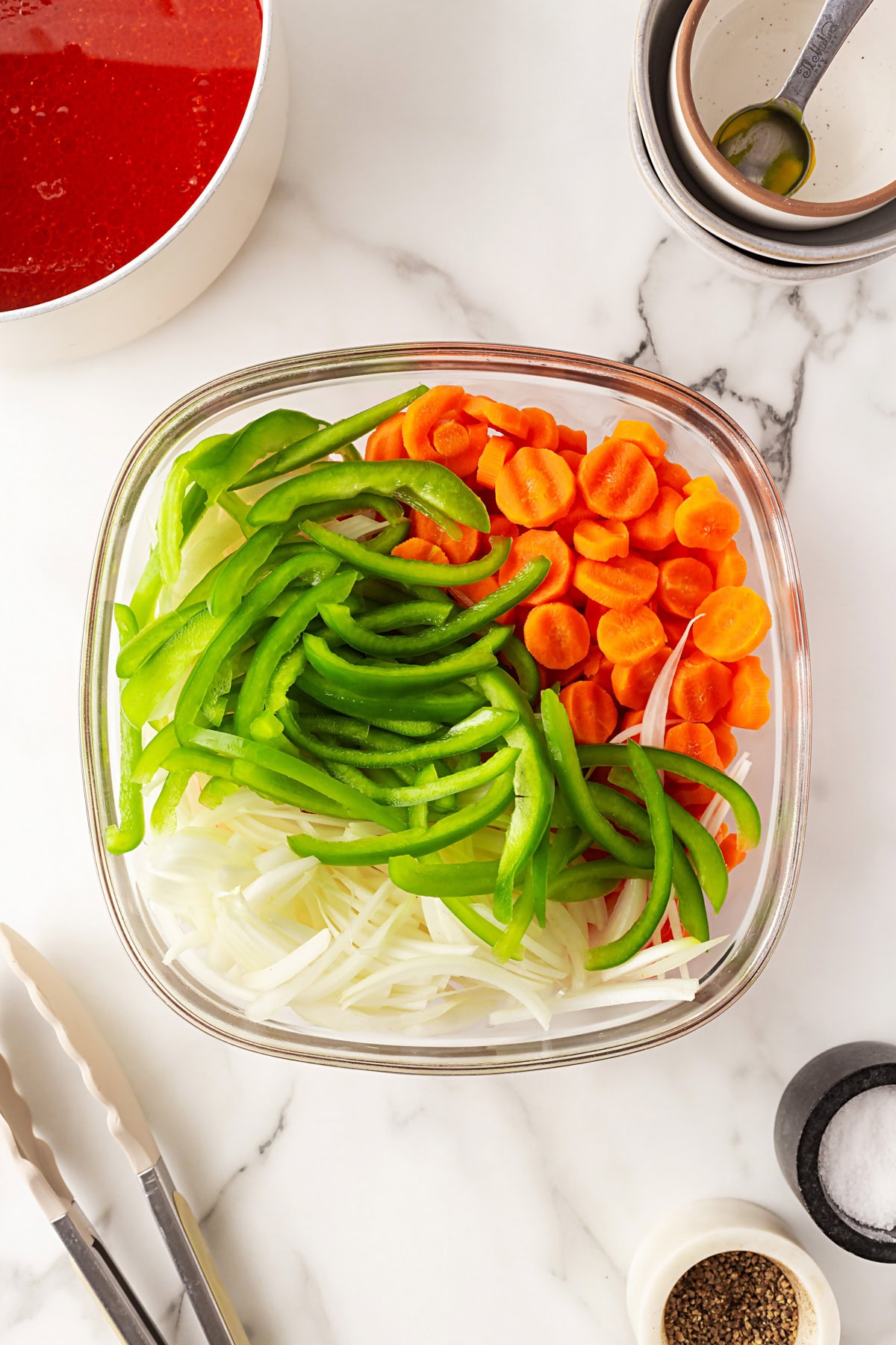 This Marinated Carrot Salad was a staple in our fridge as I grew up. It can be marinated for a long time, so it is perfect to have at the ready for any outing. Vegetables in a bowl.