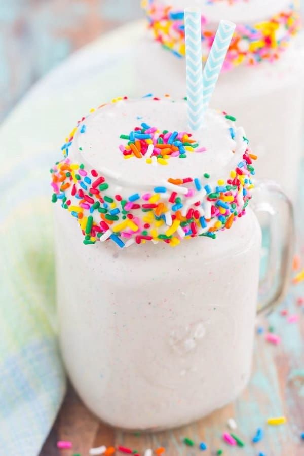 Funfetti cake batter milkshake in a glass mug with sprinkles
