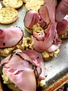 Adding on Black Forest Ham to the English muffin