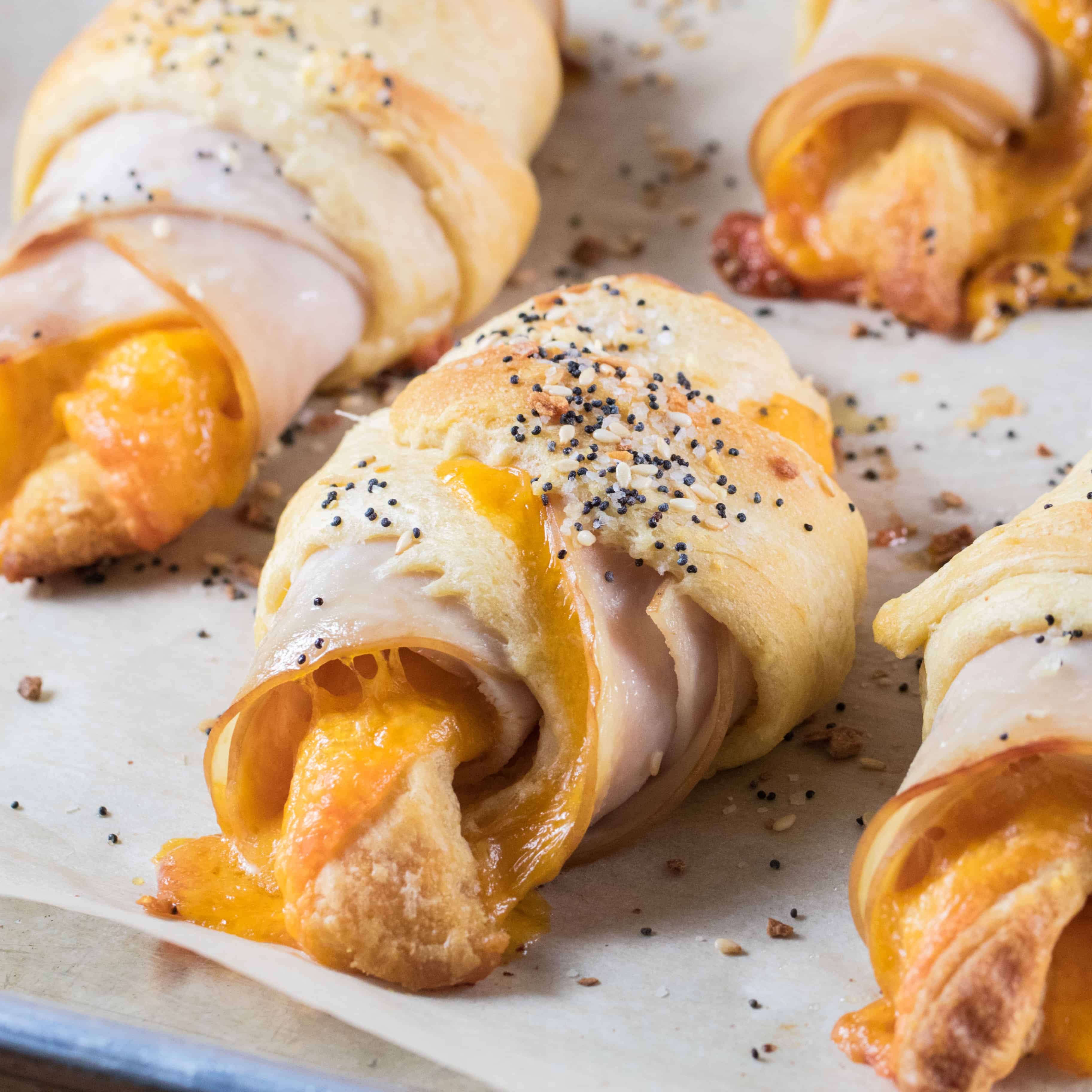 Everything Bagel Turkey Cheddar Crescent Rolls on a baking sheet 