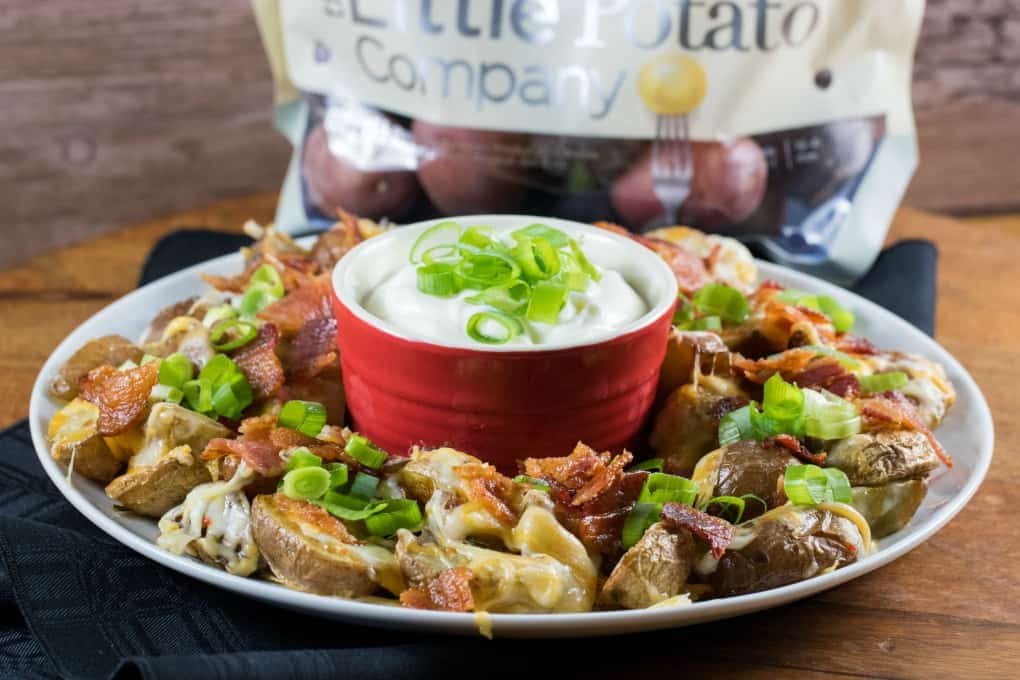 Irish Nachos on a platter with a bag of Little Potatoes in the background