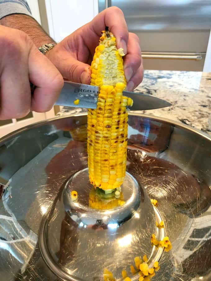 Taking corn off the cob