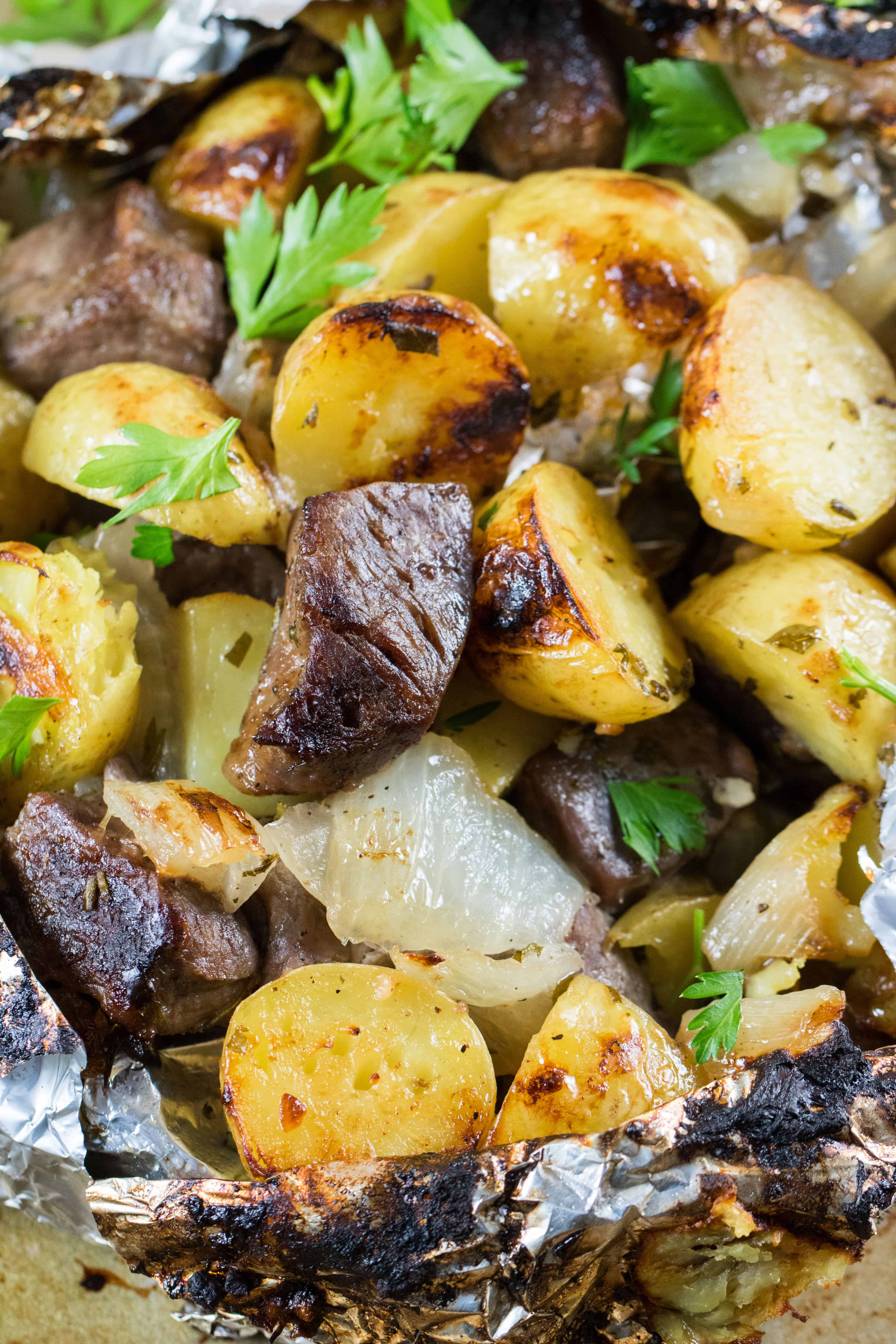 Steak, Little potatoes and sweet onions with parsley. 