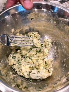 Making herb butter in a bowl
